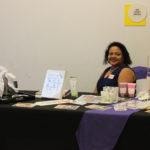 Annual Tea Party 2017 — woman at vendor table with products