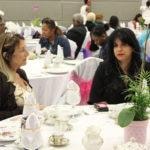 Annual Tea Party 2017 — two women seated at elegantly set table