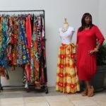 Annual Tea Party 2017 — woman in red dress beside colorful fashion display