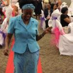 Annual Tea Party 2017 — elderly woman in blue suit walking red carpet