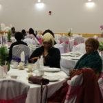 Annual Tea Party 2017 — two women seated at elegantly decorated table